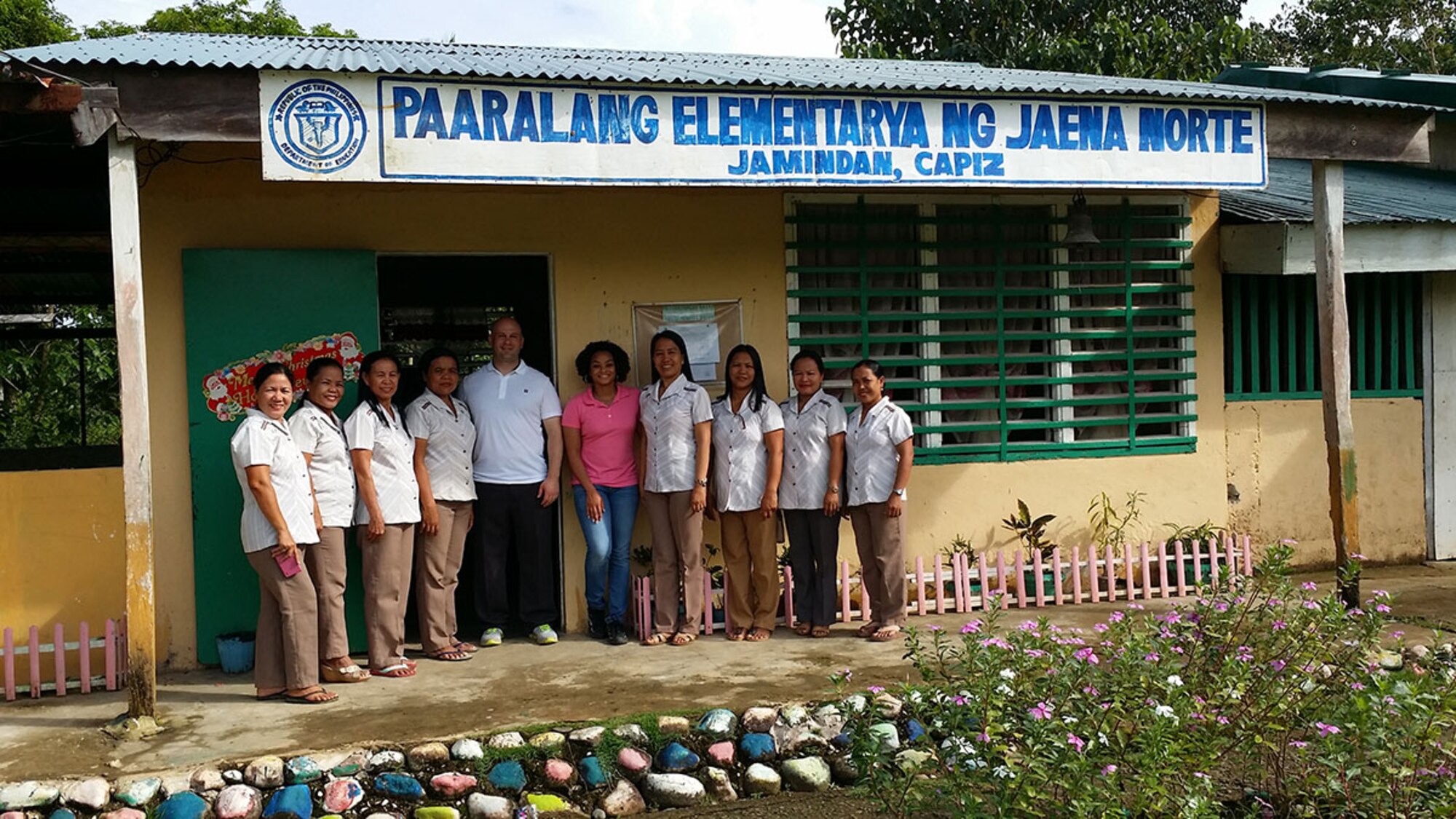 Air Force 1st Lt. Joy Johnson, 773d Civil Engineer Squadron operations engineering officer in charge, poses with school staff outside Jaena Norte elementary school, in Panay, Philippines during a site visit. Personnel with the 673d Civil Engineer Group conducted site visits prior to starting a renovation project for the school, scheduled for March 28, as part of a humanitarian and civic assistance portion of exercise Balikatan 2016. (Courtesy photo) 

