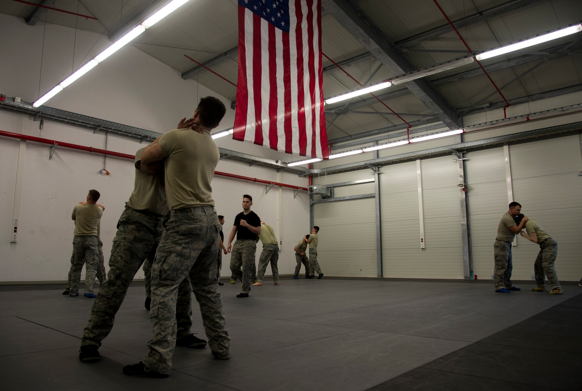 Security forces Airmen practice self-defense maneuvers during a Security Forces combative course Jan. 14, 2016, at Ramstein Air Base, Germany. Approximately 21 students attended the seven-day course to improve weapon retention and self-defense skills which can be used to handle hostile situations in the most peaceful means necessary. (U.S. Air Force photo/Senior Airman Jonathan Stefanko)