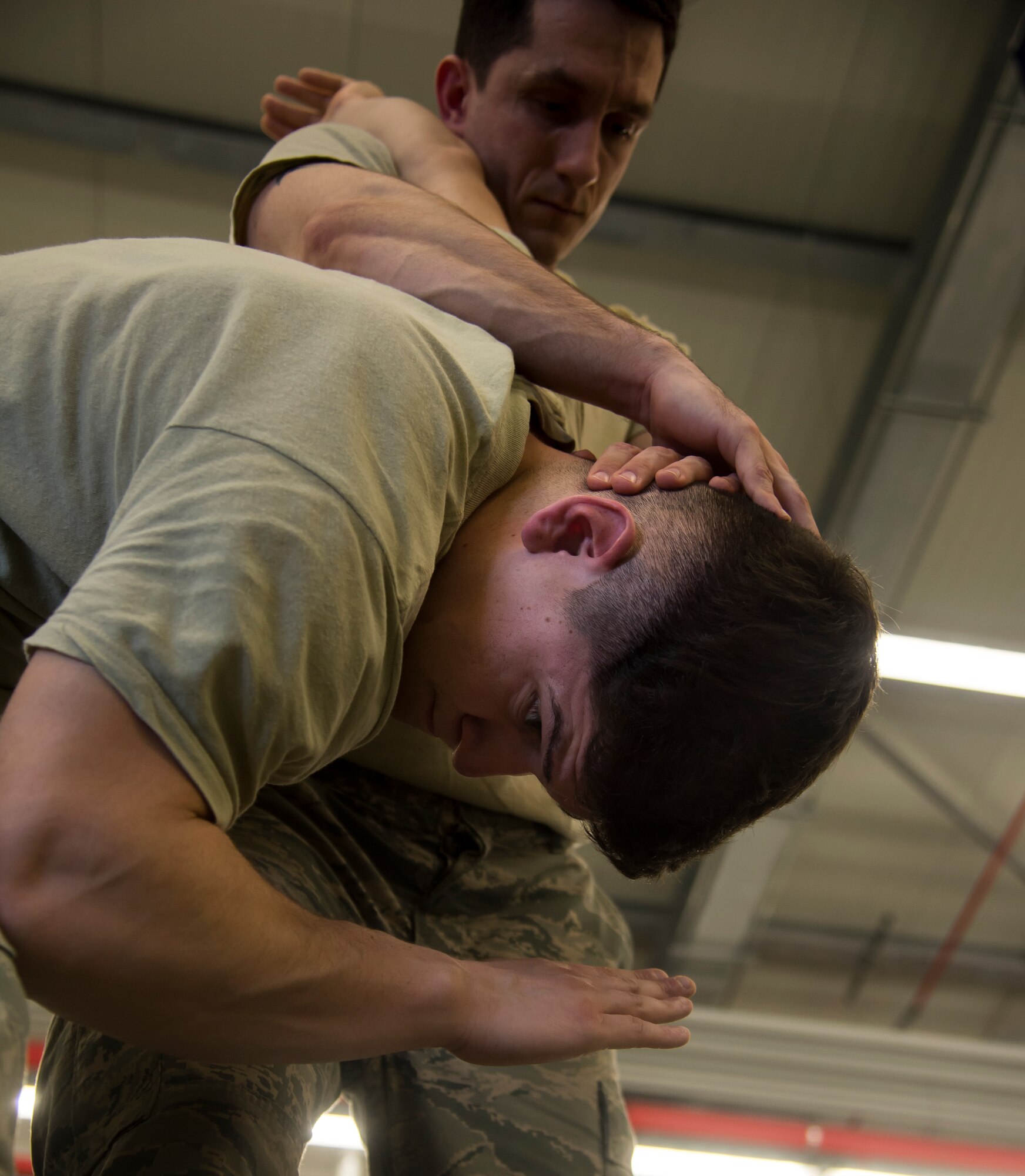 Staff Sgt. Justin Hains and Staff Sgt. Jose Ruiz, both patrolmen with the 435th Security Forces Squadron, practice self-defense maneuvers during a Security Forces combative course Jan. 14, 2016, at Ramstein Air Base, Germany. The course is designed to help defenders gain the skills, knowledge and confidence they need in order to protect and serve. (U.S. Air Force photo/Senior Airman Jonathan Stefanko)