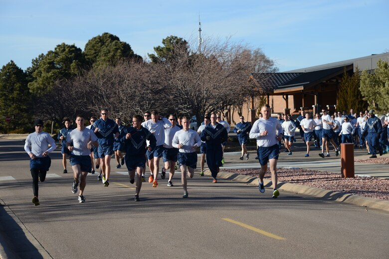 PETERSON AIR FORCE BASE, Colo. – Peterson Airmen begin the run near The Club during the first Wing Warfit of the year Jan. 19, 2016. The Airmen formed up, performed group and individual stretches and ran around the golf course. (U.S. Air Force photo by Tech. Sgt. Jared Marquis)