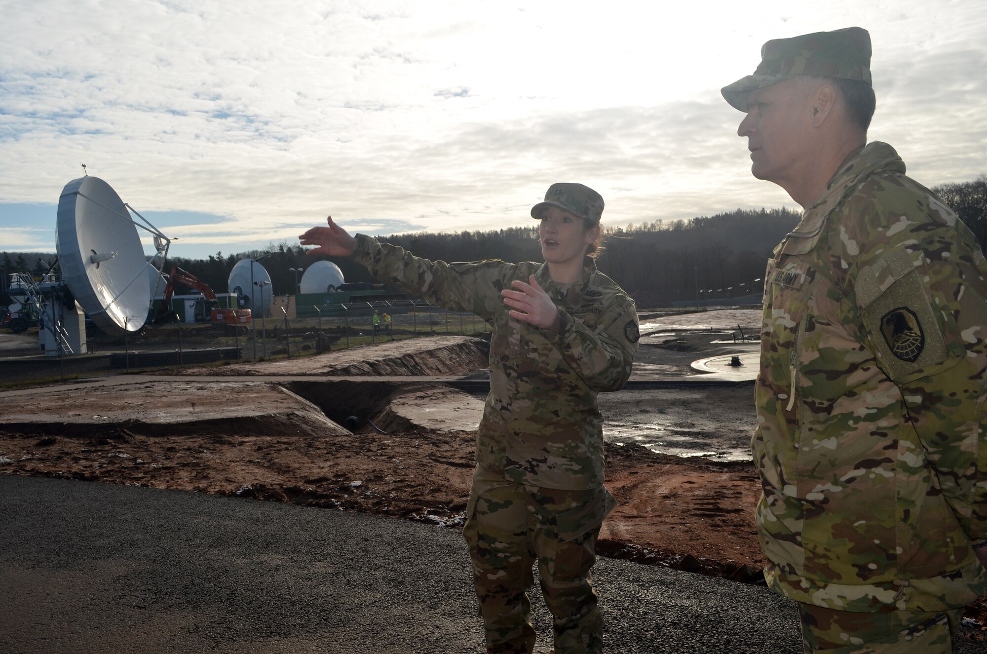 LANDSTUHL, Germany - Capt. Jessica Yahn, commander, Company C, 53rd Signal Battalion, 1st Space Brigade, shows Lt. Gen. David Mann, commanding general, U.S. Army Space and Missile Defense Command/Army Forces Strategic Command around the Wideband Satellite Communications Operations Center site at Landstuhl, Germany, Jan. 14.

