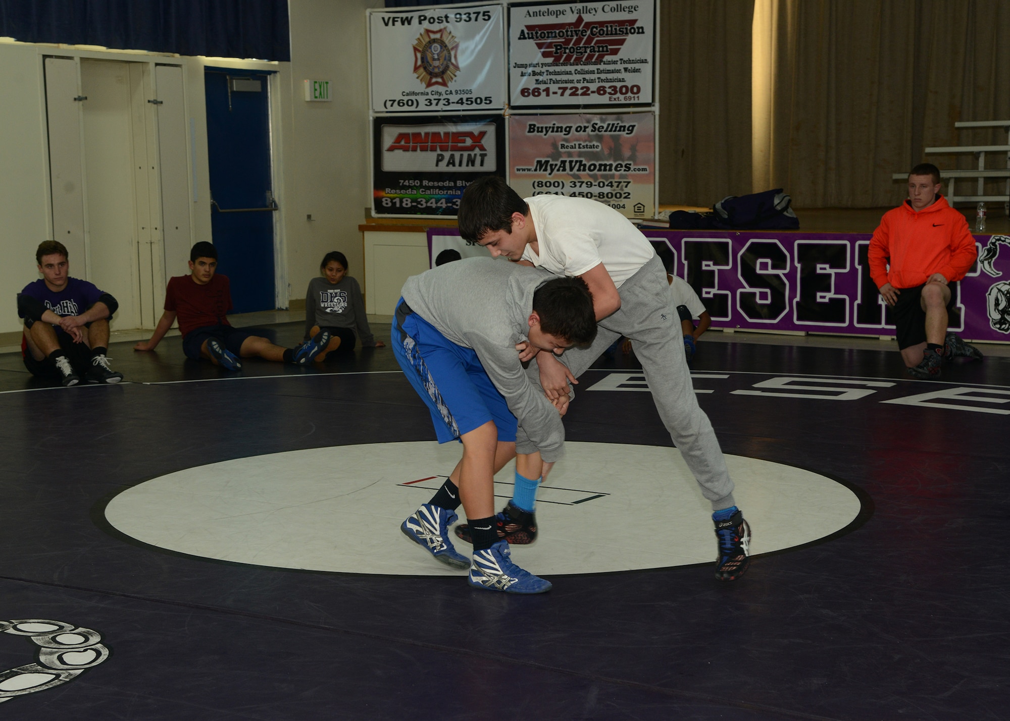 The Desert High Scorpions varsity wrestling team is able to compete for another year thanks to the volunteer efforts of this year’s six coaches. (U.S. Air Force photo by Rebecca Amber)