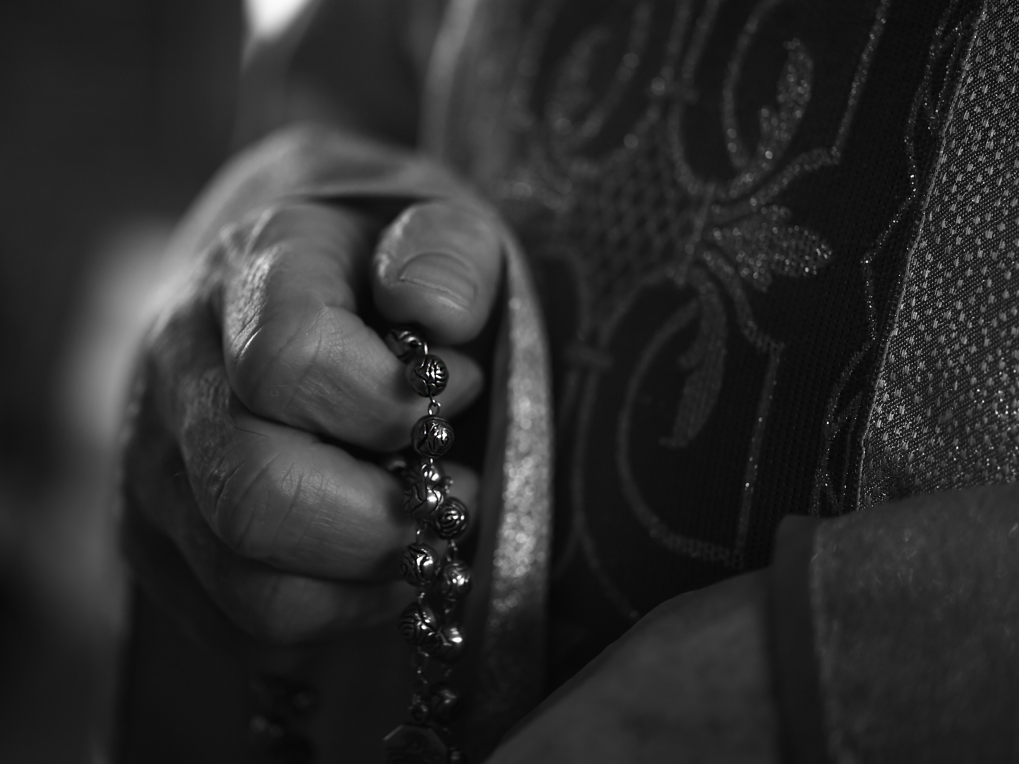 U.S. Air Force Chaplain, Maj. Mitchell Zygadlo, 501st Combat Support Wing Roman Catholic chaplain, prays with his Rosary inside the chapel on RAF Alconbury, United Kingdom, Dec. 8, 2015. From his humble beginnings as a boy growing up in Poland, Zygadlo said faith was always a strong cornerstone of his spiritual resiliency. (U.S. Air Force photo by Tech. Sgt. Jarad A. Denton/Released)
