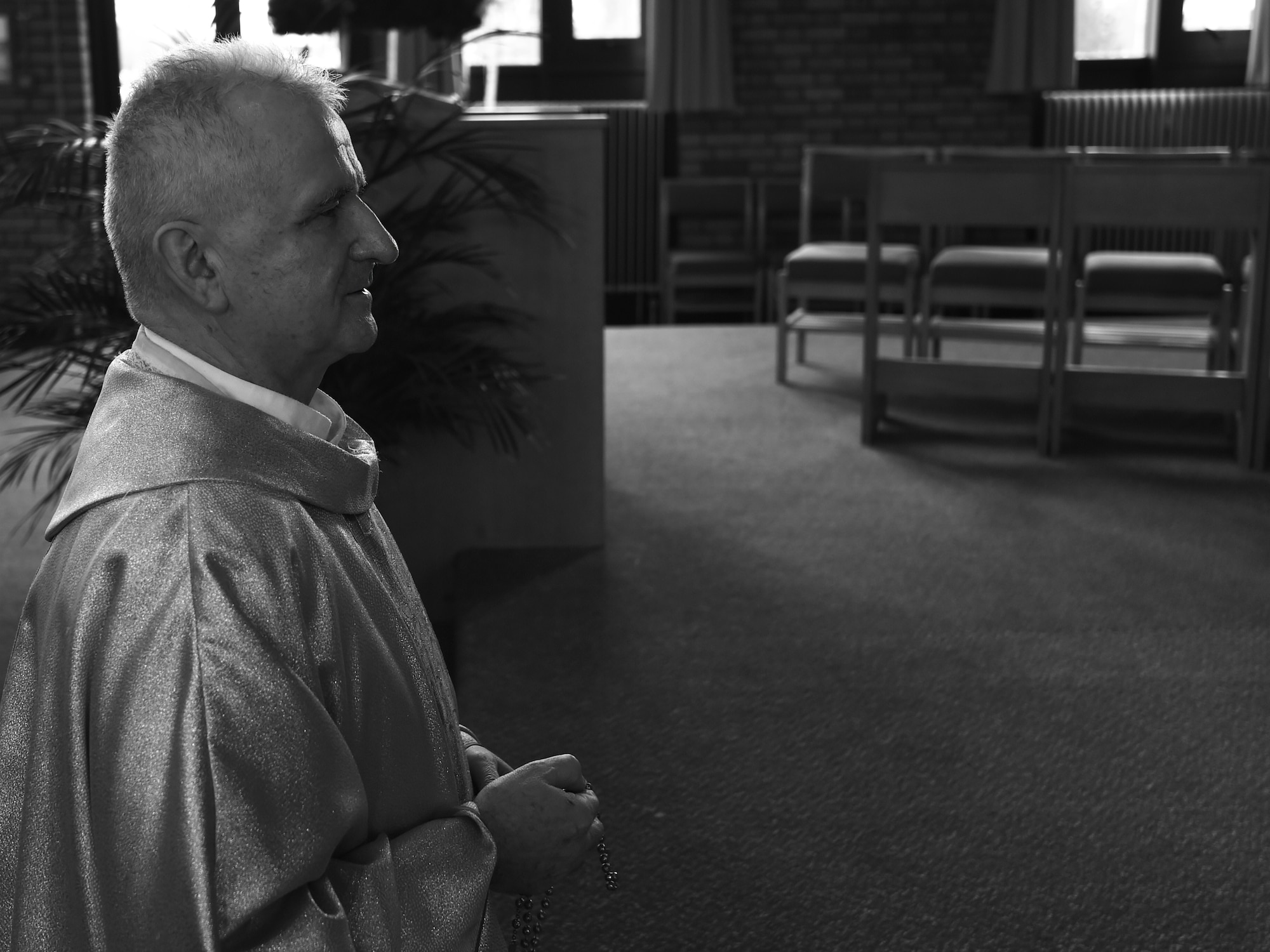 U.S. Air Force Chaplain, Maj. Mitchell Zygadlo, 501st Combat Support Wing Roman Catholic chaplain, prays in front of the chapel alter at RAF Alconbury, United Kingdom, Dec. 8, 2015. After immigrating to the United States, from Poland, Zygadlo said he was overwhelmed by the freedom enjoyed throughout America. (U.S. Air Force photo by Tech. Sgt. Jarad A. Denton/Released)
