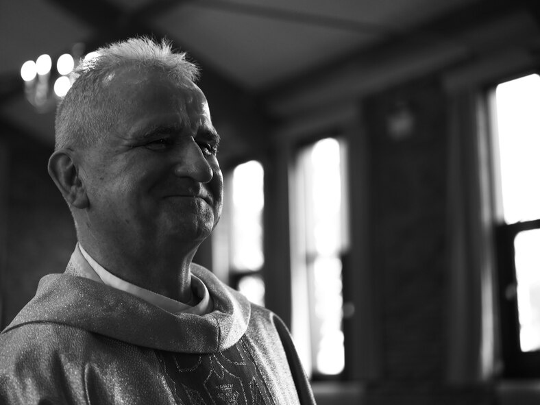 U.S. Air Force Chaplain, Maj. Mitchell Zygadlo, 501st Combat Support Wing Roman Catholic chaplain, looks around the RAF Alconbury, United Kingdom, chapel, and smiles, Dec. 8, 2015. Zygadlo, originally from Poland, immigrated to the United States following his ordination as a Catholic priest. (U.S. Air Force photo by Tech. Sgt. Jarad A. Denton/Released)