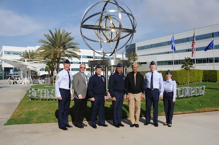 U.S. Navy Adm. Cecil D. Haney (center right), U.S. Strategic Command (USSTRATCOM) commander, poses with U.S. Air Force Lt. Gen. Samuel A. Greaves, Space and Missile Systems Center (SMC) commander and Air Force Program Executive Officer for Space (center left), and other USSTRATCOM and SMC personnel in front of the Space and Missile Systems Center headquarters at Los Angeles Air Force Base, El Segundo, Calif., Jan. 20, 2016. The Space and Missile Systems Center, part of the Air Force Space Command, is responsible for the research, development, acquisition on-orbit testing and sustainment of military space and missile systems. Air Force Space Command is a service component of USSTRATCOM. Haney visited SMC to gain a better understanding of the command and its missions. One of nine DoD unified combatant commands, USSTRATCOM has global strategic missions, assigned through the Unified Command Plan, which include strategic deterrence; space operations; cyberspace operations; joint electronic warfare; missile defense; intelligence, surveillance and reconnaissance; combating weapons of mass destruction; and analysis and targeting. (U.S. Air Force photo/Van De Ha)