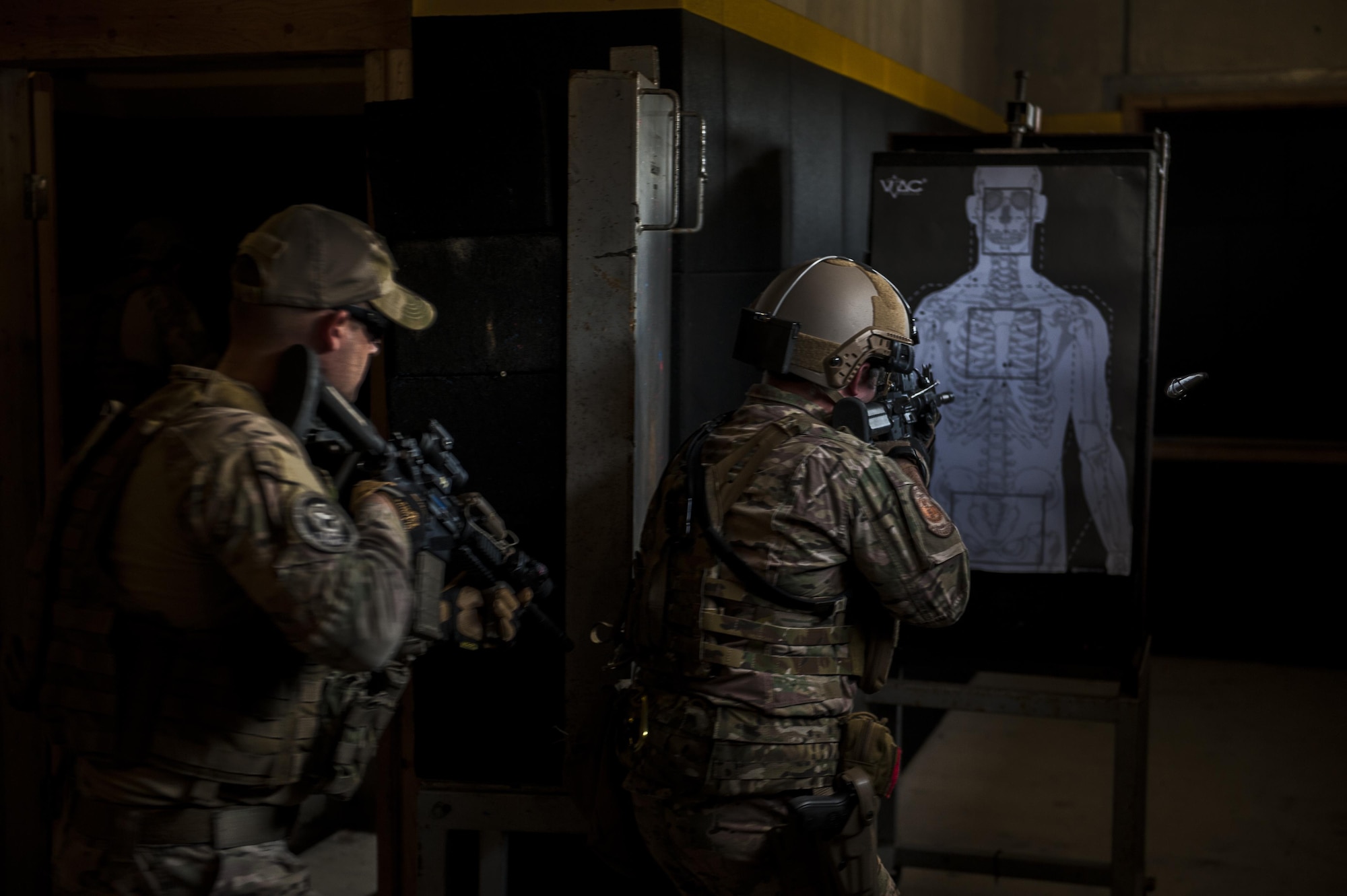 Members of the Deployed Aircraft Ground Response Element infiltrate a building on Dec. 22, 2015 on Camp Hansen, Okinawa, Japan.  The element was established in 2007 as a group of highly trained security forces personnel who support United States Special Operations Command assets and resources worldwide.  (U.S. Air Force photo by Airman 1st Class Nick Emerick)