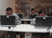 Saipan-based Soldiers with the 302nd Quartermaster Company – Detachment 1, 9th Mission Support Command, U.S. Army Reserve, go online to check their military emails, as well as to conduct mandatory Web-based training during battle assembly at the U.S. Army Reserve Center, Saipan, Jan. 10. The Deployed Digital Training Campus (DDTC), which comes with laptops and video teleconferencing capabilities, enhances these Soldiers’ training and readiness by allowing them access to military websites, typically not accessible from home.