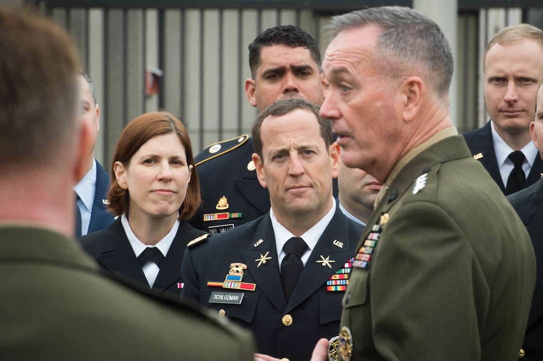 U.S. Marine Corps Gen. Joseph F. Dunford Jr., chairman of the Joint Chiefs of Staff, talks with members of a U.S. military delegation at NATO headquarters in Brussels, Jan. 20, 2016. DoD photo by D. Myles Cullen