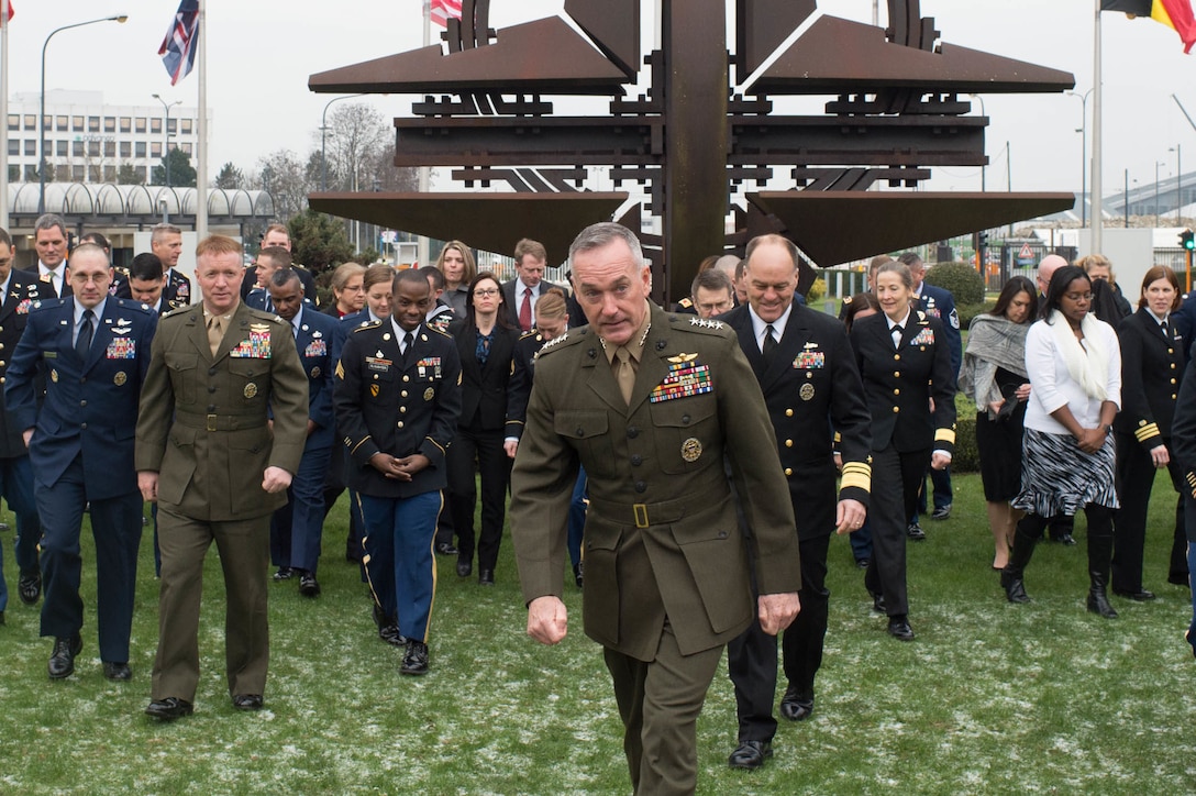 U.S. Marine Corps Gen. Joseph F. Dunford Jr., chairman of the Joint Chiefs of Staff, walks with service members and civilians at NATO headquarters in Brussels, Jan. 20, 2016. Dunford is in Brussels to attend a NATO Military Committee chiefs of staff meeting. DoD photo by D. Myles Cullen
