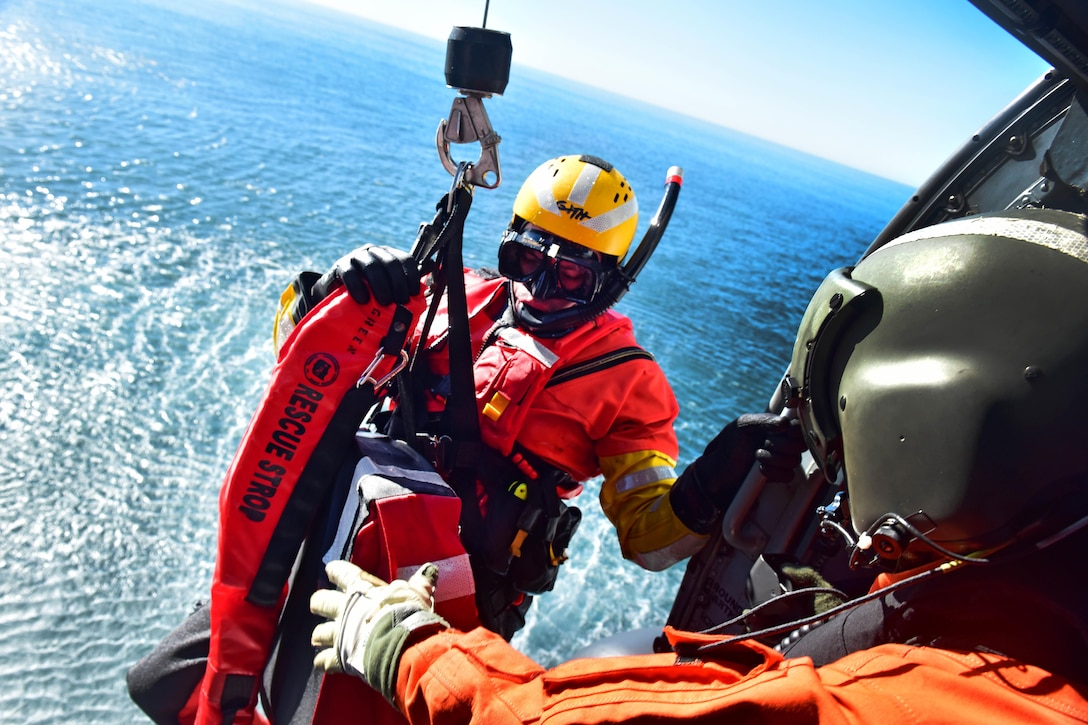 Coast Guard Petty Officer 2nd Class Kris Grimm practices hoisting technique during a training exercise off the coast of San Diego, Jan. 12, 2016.  U.S. Coast Guard photo by Petty Officer 1st Class Rob Simpson