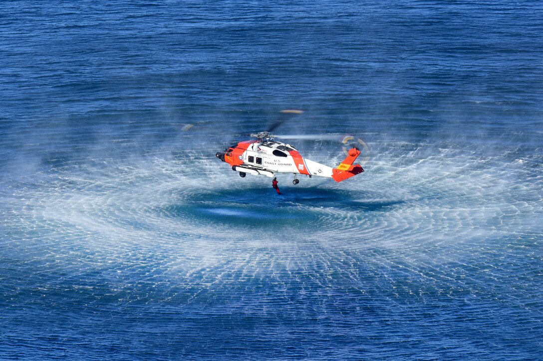 Coast Guard Petty Officer 2nd Class Ryan Pierce free falls into the water from an MH-60 Jayhawk helicopter off the coast of San Diego, Jan. 12, 2016. Pierce is an aviation survival technician assigned to Coast Guard Sector San Diego. U.S. Coast Guard photo by Petty Officer 1st Class Rob Simpson