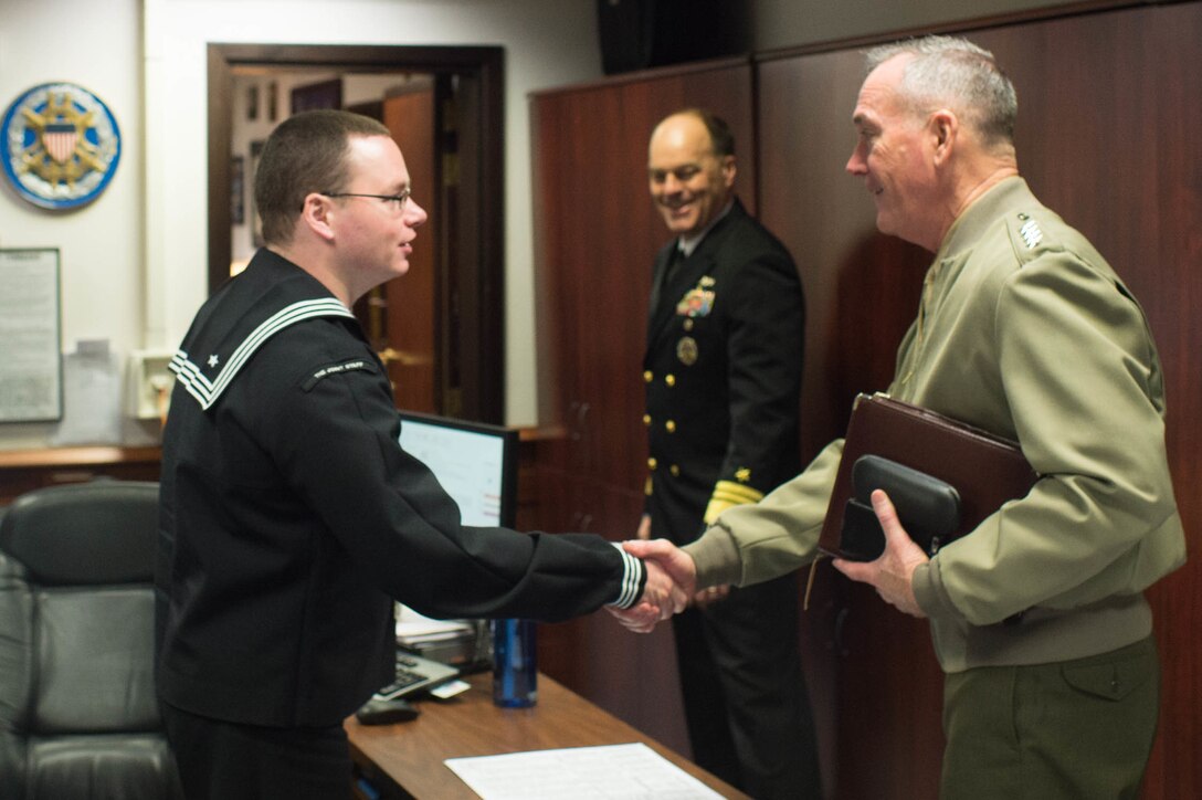 U.S. Marine Corps Gen. Joseph F. Dunford Jr., chairman of the Joint Chiefs of Staff, shakes hands with a service member at NATO headquarters in Brussels, Jan. 20, 2016. DoD photo by D. Myles Cullen