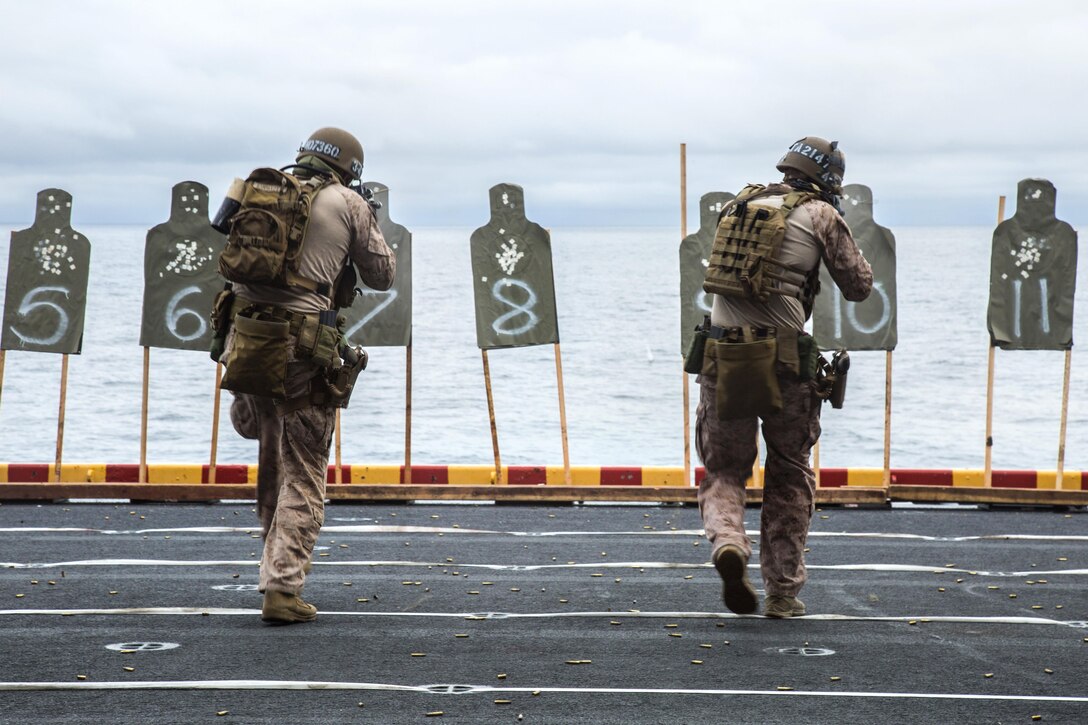 U.S. Marines fire weapons on deck during a sustainment exercise aboard the USS Boxer at sea, January 18, 2016. U.S. Marine Corps photo by Sgt. Hector de Jesus