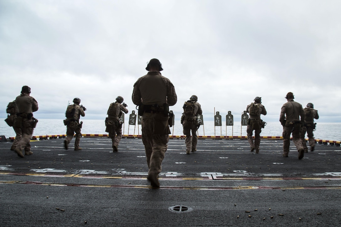 U.S. Marines fire their weapons on deck shoot during an exercise aboard the USS Boxer at sea, Jan. 18, 2016. U.S. Marine Corps photo by Sgt. Hector de Jesus