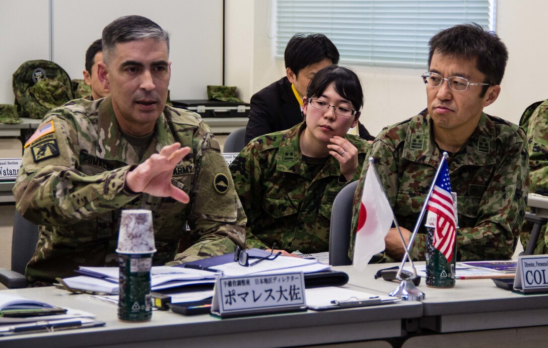 U.S. Army Col. Luis Pomales (left), a San Juan, Puerto Rico, native serving as the director of the Army Reserve Engagement Team-Japan (ARET-J), explains the U.S. Army Reserve's structure, missions and capabilities to Japan Ground Self-Defense Force Reserve Component service members during a command briefing conducted at JGSDF Western Army’s headquarters in Camp Kenjun, Japan, Jan. 15, 2016. The meeting was one of several cultural, social and military training engagements designed to enhance the bilateral partnership between ARET-J and the JGSDF Western Army's Reserve Component. (U.S. Army photo by Sgt. John L. Carkeet IV, U.S. Army Japan)