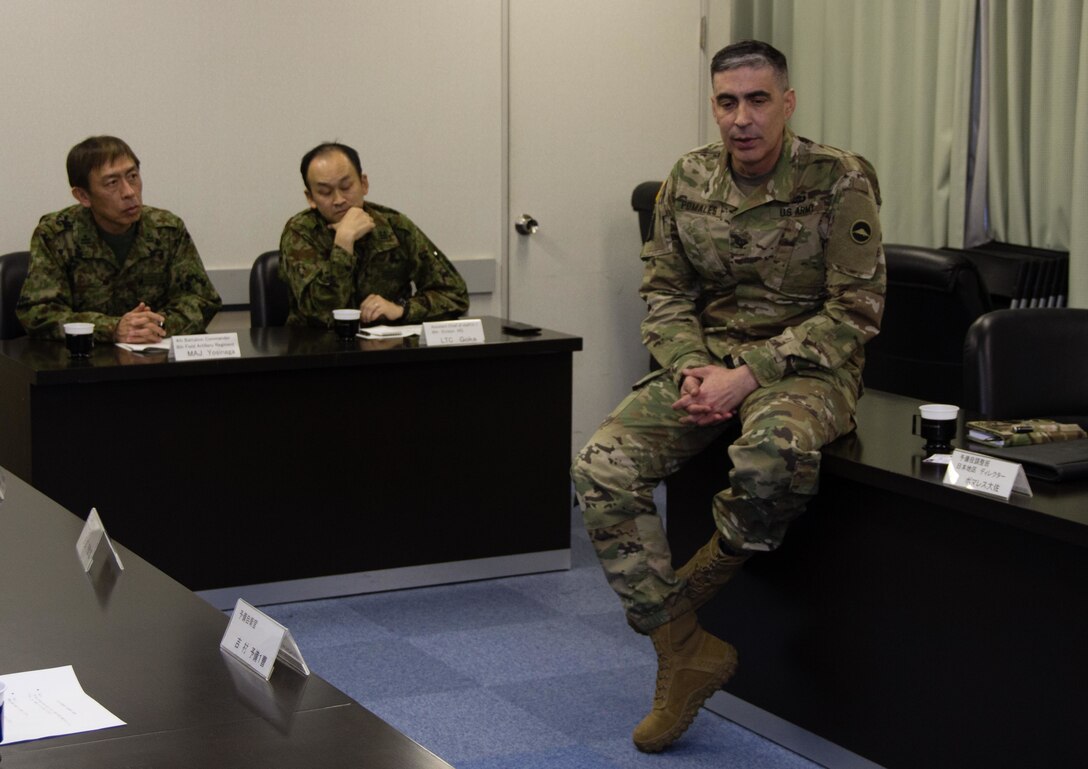 During a round table discussion conducted Jan. 16, 2016, at Camp Kenjun, Japan, U.S. Army Col. Luis Pomales (left), a San Juan, Puerto Rico, native serving as the director of the Army Reserve Engagement Team-Japan (ARET-J), discusses methods to build closer relations between Japan Ground Self Defense Force (JGSDF) Reserve Component service members and their respective civilian employers. The candid meeting was one of several social, cultural and military training events that culminated into one of the first bilateral engagements conducted exclusively by ARET-J and JGSDF Western Army Reserve Component (U.S. Army photo by Sgt. John L. Carkeet IV, U.S. Army Japan)