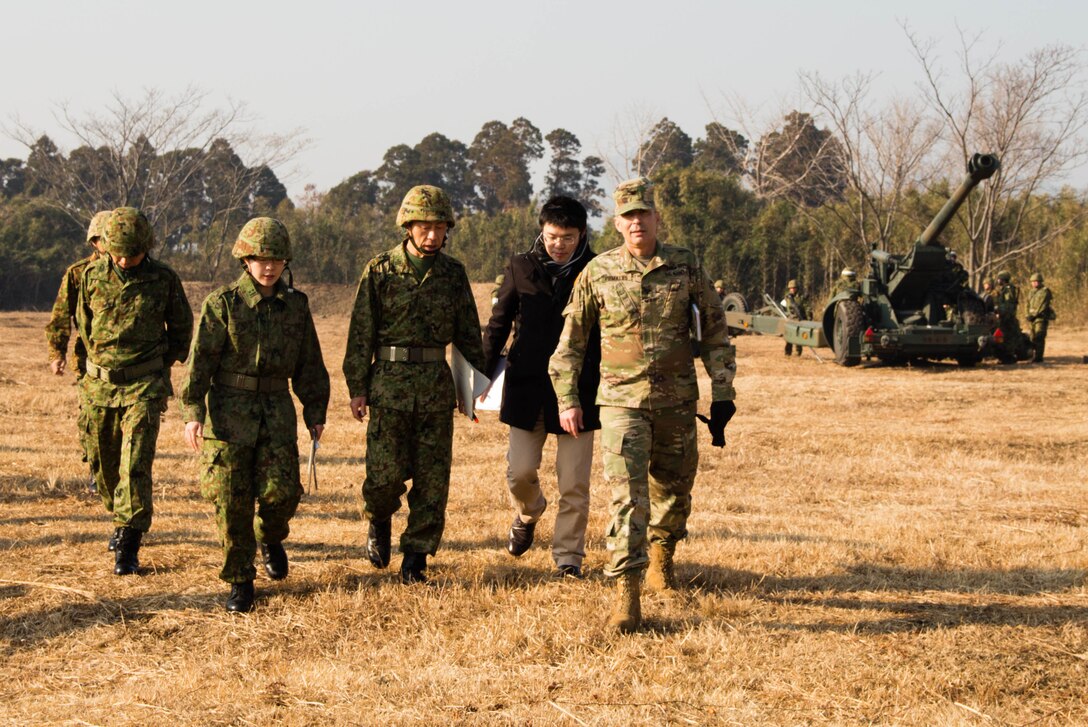 U.S. Army Col. Luis Pomales (right), a San Juan, Puerto Rico, native serving as the director of the Army Reserve Engagement Team-Japan (ARET-J), observes an exercise conducted by the 8th Artillery Regiment, Western Army, Japan Ground Self-Defense Force (JGSDF) at Kuroishibaru training grounds near Camp Kenjun, Japan, Jan. 16, 2016.    The bilateral observation was one of several cultural, social and military training engagements designed to enhance the partnership between ARET-J and the JGSDF Western Army's Reserve Component. (U.S. Army photo by Sgt. John L. Carkeet IV, U.S. Army Japan)