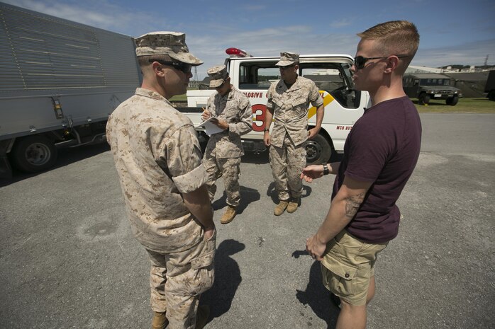 Explosive ordinance disposal technicians interview Gunnery Sgt. Matthew Lentz (right) Sept. 22 during a mock bomb threat as part of Exercise Constant Vigilance 2015 aboard Camp Foster, Okinawa, Japan. EOD technicians must gather as much information from witnesses in order to properly assess a situation. “Response time is paramount in these types of situations,” said Gunnery Sgt. Amos Miller, the staff noncommissioned officer in charge with EOD. “As soon as we receive the call we begin using all the information given to us about a situation to determine what we’ll need.”