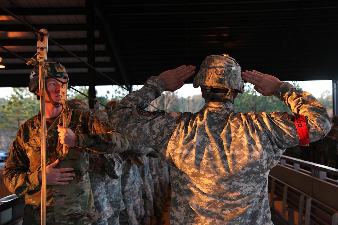 An Army jumpmaster rehearses with other paratroopers for the proficiency jump program at Pope Army Airfield on Fort Bragg, N.C., Jan. 16, 2016. The paratroopers are assigned to the 82nd Airborne Division. The program aims to improve jumper currency across the XVIII Airborne Corps and provide soldiers' families exposure to airborne operations. U.S. Army photo by Spc. Kevin Kim