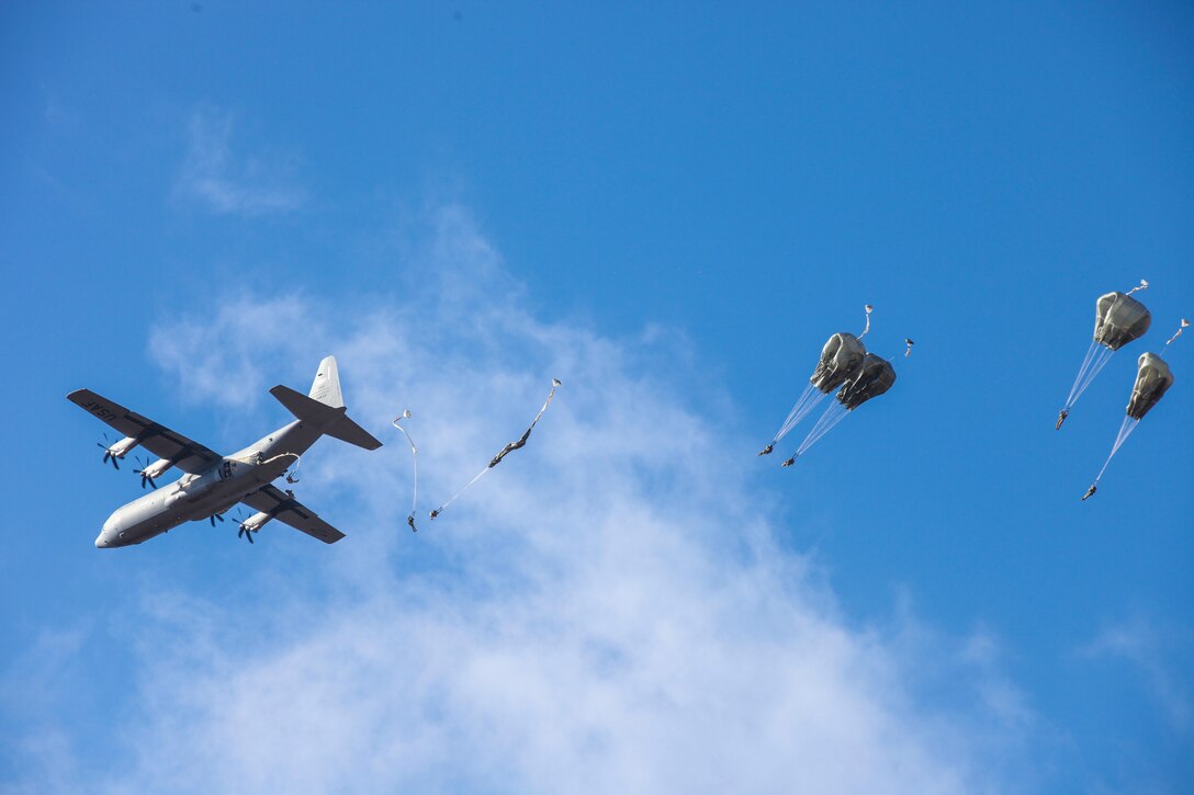 Paratroopers jump out of an Air Force C-130 aircraft during a proficiency jump program at Pope Army Airfield on Fort Bragg, N.C., Jan. 16, 2016. U.S. Army photo by Spc. Kevin Kim