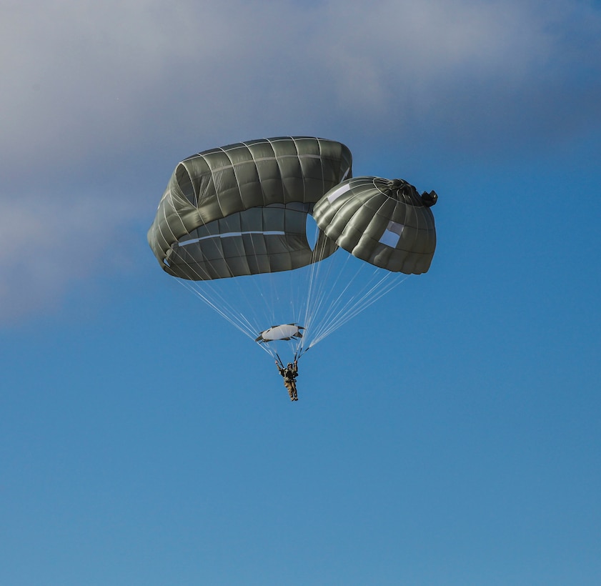 A paratrooper descends to the drop zone during a proficiency jump program at Pope Army Airfield on Fort Bragg, N.C., Jan. 16, 2016. U.S. Army photo by Spc. Kevin Kim 