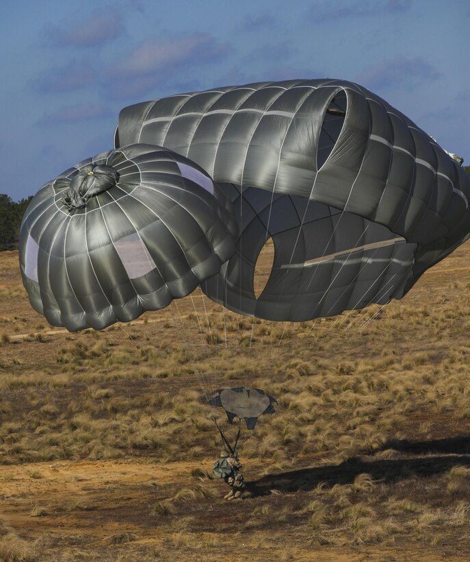 A paratrooper lands on the drop zone during a proficiency jump program at Pope Army Airfield on Fort Bragg, N.C., Jan. 16, 2016. U.S. Army photo by Spc. Kevin Kim