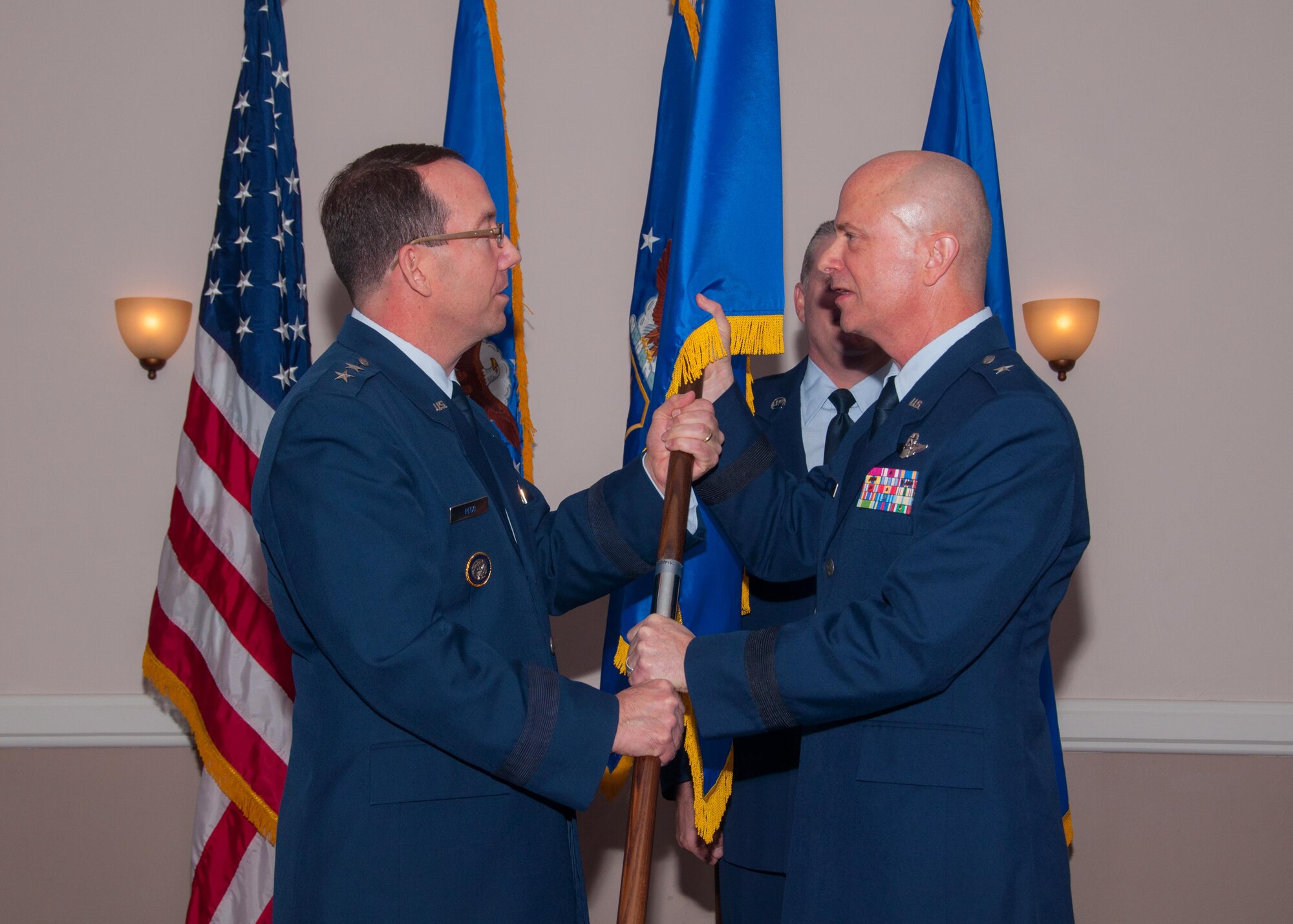 U.S. Air Force Maj. Gen. Robert Rego, Mobilization Assistant to the Commander, US Strategic Command, presents Brig. Gen. Jonathan Ellis, Mobilization Assistant to the Director of Operations Air Force Global Strike Command, with a one star flag during a pinning ceremony, Jan. 15, 2016 at Barksdale Air Force Base, La. Throughout military history; a General Officer’s flag symbolizes his command on the battlefield. (U.S. Air Force photo by Master Sgt. Laura Siebert/Released)