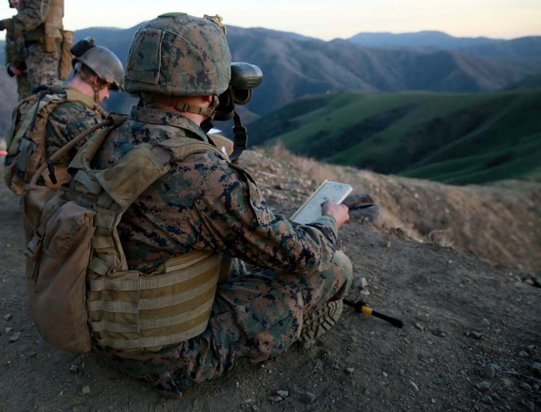 A Joint Fire Observer watches the impact of an 81 mm mortar round to forward corrections needed to accurately hit a target during training on the hillsides of Marine Corps Base Camp Pendleton, Calif., Jan. 13, 2016. The JFOs work hand-in-hand with the Joint Tactical Attack Controllers to accurately and effectively strike targets with either artillery or aircraft. The Marines are with 1st Air Naval Gunfire Liaison Company, I Marine Expeditionary Force. (U.S. Marine Corps photo by Lance Cpl. Timothy Valero/ Released)