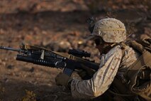 A Marine assigned to Company B, 1st Battalion, 1st Marine Regiment, 1st Marine Division, conducts a tactical reload during a company-level assault, as part of combined arms live-fire, Marine Rotational Force – Darwin exercise aboard Marine Corps Air Ground Combat Training Center Twentynine Palms, Calif., Jan. 18, 2016. The Marines completed the training as part of their preparations for an upcoming deployment to Australia.