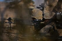 Marines assigned to Company B, 1st Battalion, 1st Marine Regiment, 1st Marine Division, fire on an objective during a company-level assault, as part of combined arms live-fire, Marine Rotational Force – Darwin exercise, aboard Marine Corps Air Ground Combat Training Center Twentynine Palms, Calif., Jan. 18, 2016. The Marines completed the training as part of their preparations for an upcoming deployment to Australia.