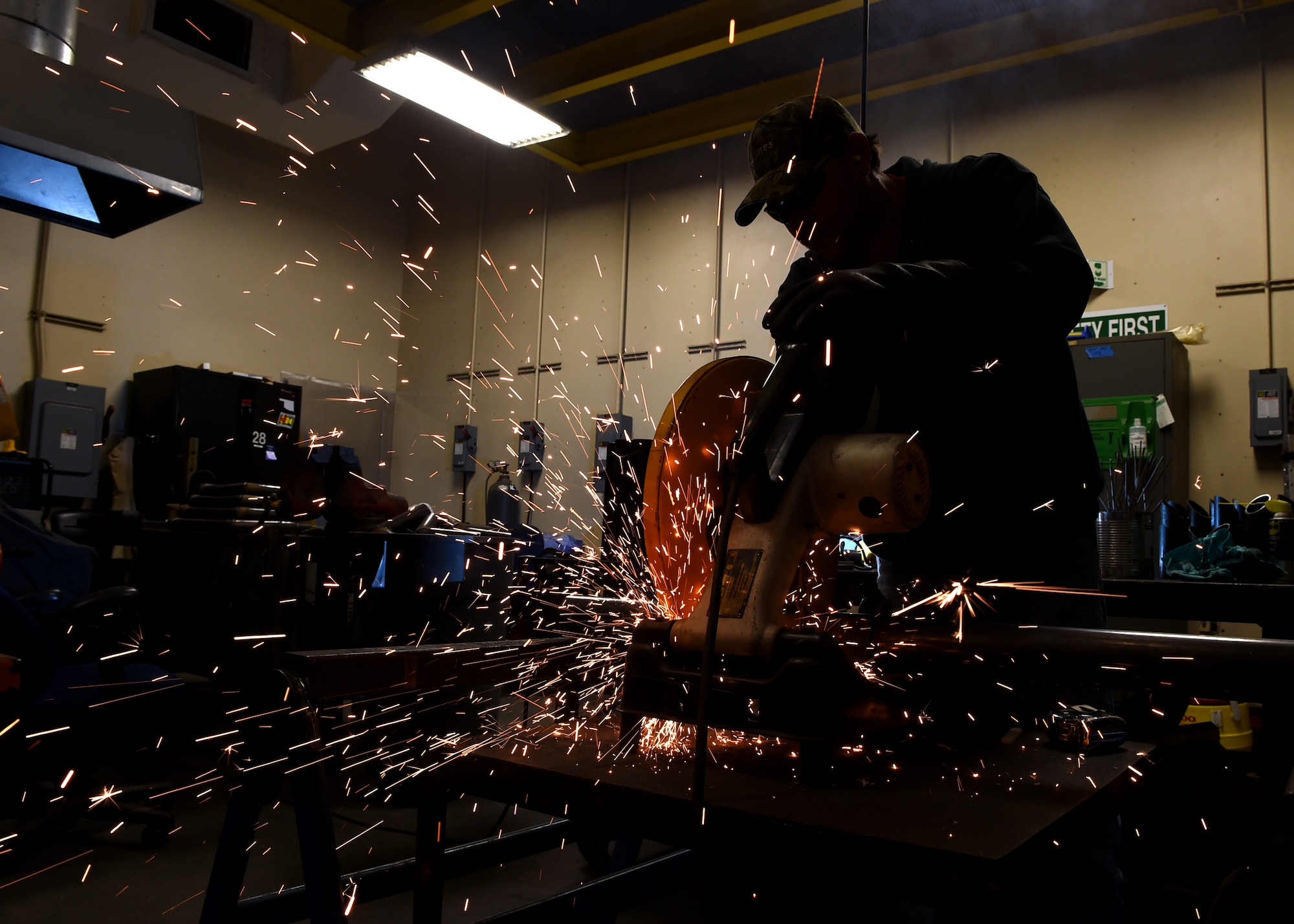 Michael Guthrie, 97th Civil Engineer Squadron maintenance mechanic, fabricates fence brackets for the base perimeter wall near base housing, Jan. 15 at Altus Air Force Base, Okla. Members of the 97th Civil Engineer Squadron and the 97th Security Forces Squadron teamed up to improve base security by installing additional force protection measures along 3,200 feet of the base’s perimeter fence.