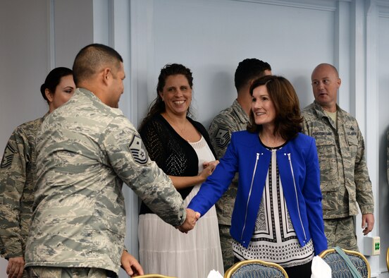 Betty Welsh, spouse of Air Force Chief of Staff Gen. Mark A. Welsh III, greets base leaders and spouses during a luncheon Jan. 21, 2016, at Andersen Air Force Base, Guam. Accompanying her husband on his visit to the base, Betty discussed the challenges spouses face and thanked them for supporting their partners. (U.S. Air Force photo/Senior Airman Cierra Presentado)