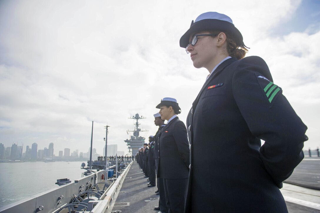 U.S. Sailors man the rails on the flight deck of the USS John C. Stennis as it gets underway for a regularly scheduled deployment in the Pacific Ocean, Jan. 20, 2016. Part of the green fleet, the Stennis provides a combat-ready force to protect collective maritime interests in the U.S. 3rd Fleet area of operations. U.S. Navy photo by Petty Officer 2nd Class Jonathan Jiang