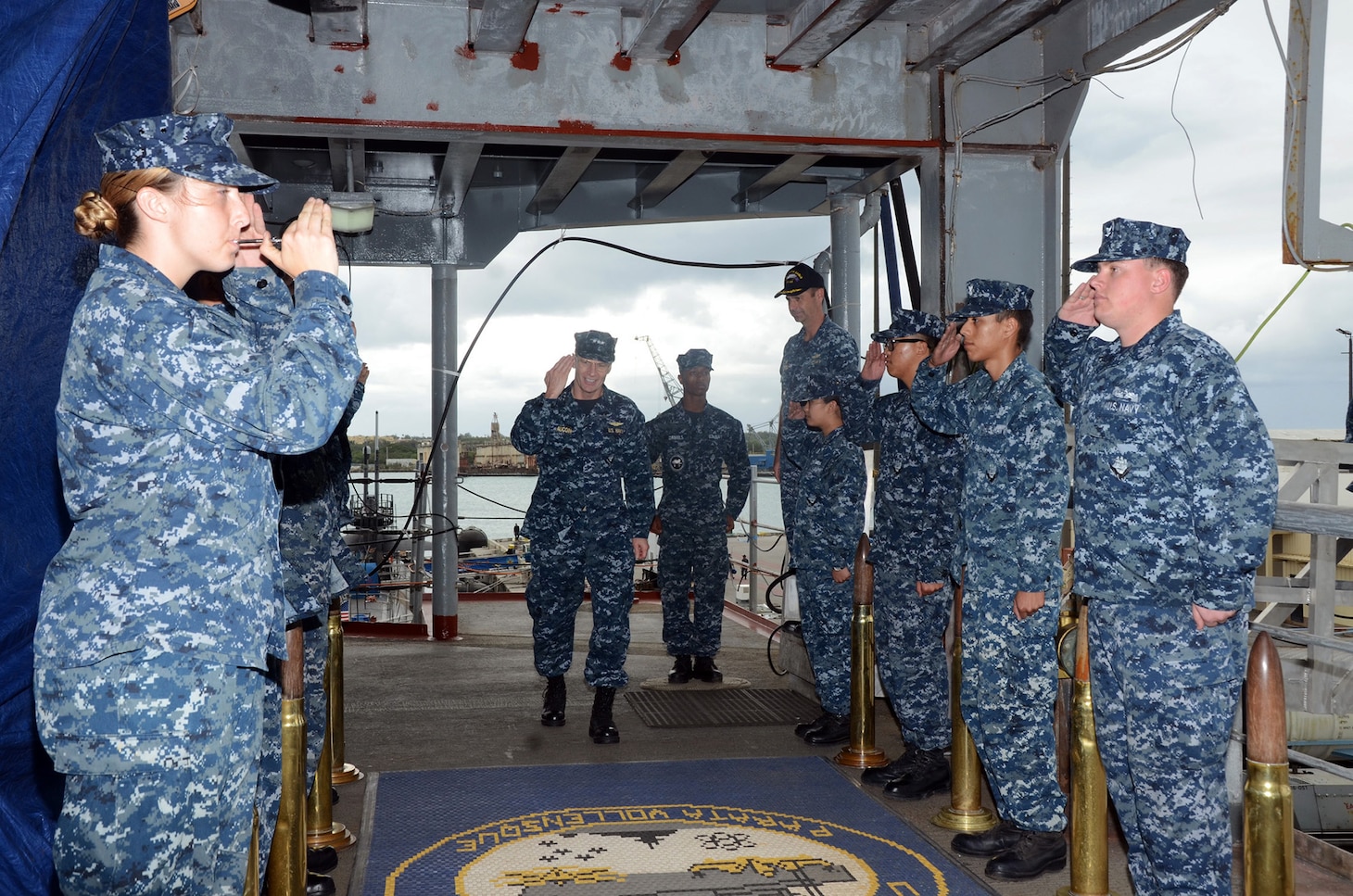 160121-N-YM720-001:
POLARIS POINT, Guam (January 21, 2016) -- Vice Adm. Joseph Aucoin, center, commander, U.S. 7th Fleet, returns a salute as he walks through the side boys as he comes aboard the Submarine Tender USS Frank Cable (AS 40), Jan. 21.  Aucoin visited Frank Cable to see first hand the repair capabilities the ship offers to units in the 7th Fleet.  During the tour of the ship, Aucoin met with Frank Cable Sailors who demonstrated their shop's repair capabilities that are offered to submarines and surface ships.  Frank Cable, forward deployed to the island of Guam, conducts maintenance and support of submarines and surface vessels deployed to the U.S. 7th Fleet area of responsibility.

(U.S. Navy photo by Mass Communication Specialist 3rd Class Allen Michael McNair/Released)
