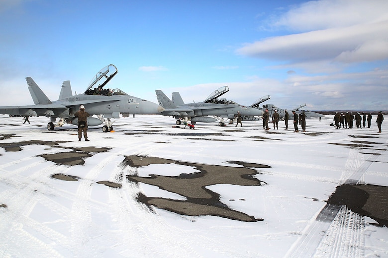 Maintainers with Marine All-Weather Fighter Attack Squadron (VMFA) 224 prepare F/A-18D Hornets to take off at Chitose Air Base in Hokkaido, Japan, Jan. 14, 2016. VMFA (AW)-224, homebased at MCAS Beaufort, S.C., is temporarily based in Iwakuni on a unit deployment program and deployed to Northern Japan to participate in the Chitose Aviation Training Relocation Exercise Jan. 12-22. During the exercise, the squadron conducted dissimilar air combat training with and against the Japan Air Self-Defense Force to further support combined interoperability and Pacific theater security cooperation.