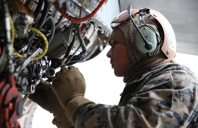 Sgt. Avelinobong Quero, fixed-wing aircraft mechanic with Marine All-Weather Fighter Attack Squadron (VMFA) 224, works on an F/A-18D Hornet at Chitose Air Base apron in Hokkaido, Japan, Jan. 13, 2016. VMFA (AW)-224, homebased at MCAS Beaufort, S.C., is temporarily based in Iwakuni on a unit deployment program and deployed to Northern Japan to participate in the Chitose Aviation Training Relocation Exercise Jan. 12-22. During the exercise, the squadron conducted dissimilar air combat training with and against the Japan Air Self-Defense Force to further support combined interoperability and Pacific theater security cooperation.