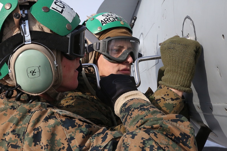 Sgt. Leonard Archuleta, an avionics collateral duty quality assurance representative, right, and Lance Cpl. Sean Stiles, an avionics technician, left, with Marine All-Weather Fighter Attack Squadron (VMFA) 224 work on an F/A-18D Hornet at Chitose Air Base in Hokkaido, Japan, Jan. 14, 2016. VMFA (AW)-224, homebased at MCAS Beaufort, S.C., is temporarily based in Iwakuni on a unit deployment program and deployed to Northern Japan to participate in the Chitose Aviation Training Relocation Exercise Jan. 12-22. During the exercise, the squadron conducted dissimilar air combat training with and against the Japan Air Self-Defense Force to further support combined interoperability and Pacific theater security cooperation.