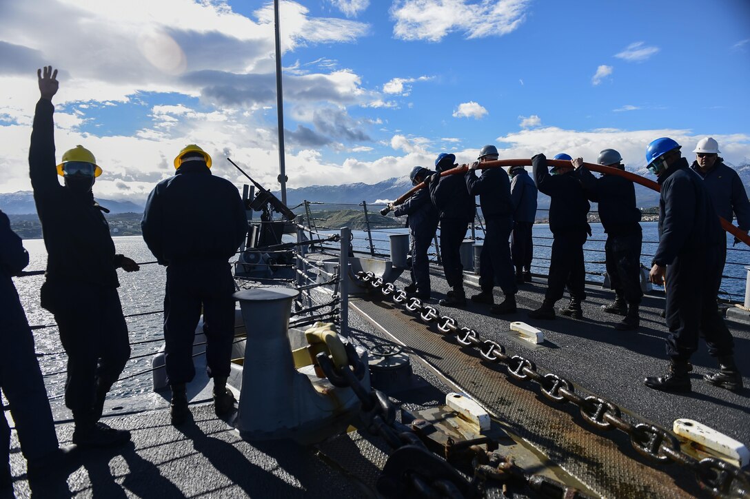 U.S. sailors aboard USS Carney clean the anchor chain after departing Souda Bay, Greece, Jan. 20, 2016.  Carney, a guided-missile destroyer, is patrolling in the U.S. 6th Fleet area of operations to support U.S. national security interests in Europe. U.S. Navy photo by Petty Officer 1st Class Theron J. Godbold