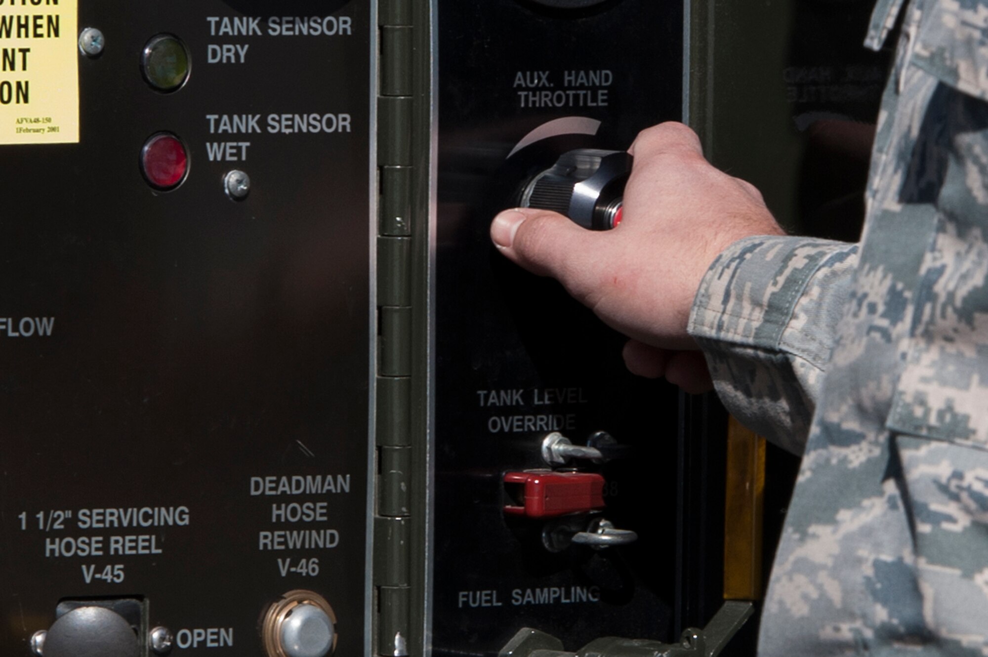 U.S. Air Force Senior Airman Phillip Switzer, 23d Logistics Readiness Squadron fuels facilities technician, turns the auxiliary throttle on a fuel truck, Jan. 20, 2016, at Moody Air Force Base, Ga. Turning the throttle increases the flow rate of the fuel to the aircraft. (U.S. Air Force photo by Airman 1st Class Kathleen D. Bryant/Released)
