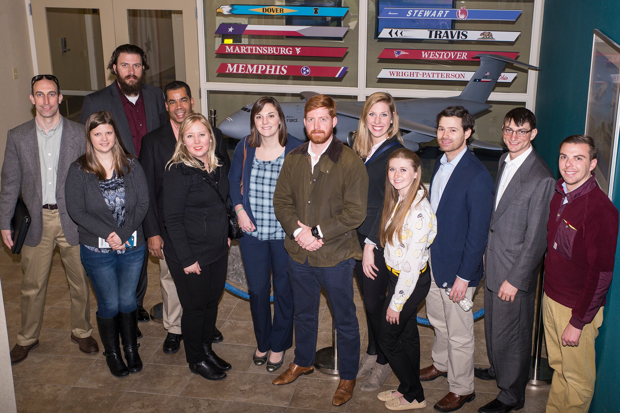 Congressional staffers from Washington D.C. pose for a photo in front of a model C-5A Galaxy aircraft at the 733rd Training Squadron Jan.19, 2016 at Joint Base San Antonio-Lackland, Texas. The staffers visited Air Reserve units on JBSA which included the 433rd Airlift Wing and 960th Cyberspace Operations Group on Lackland.  (U.S. Air Force photo by Benjamin Faske) (Released)