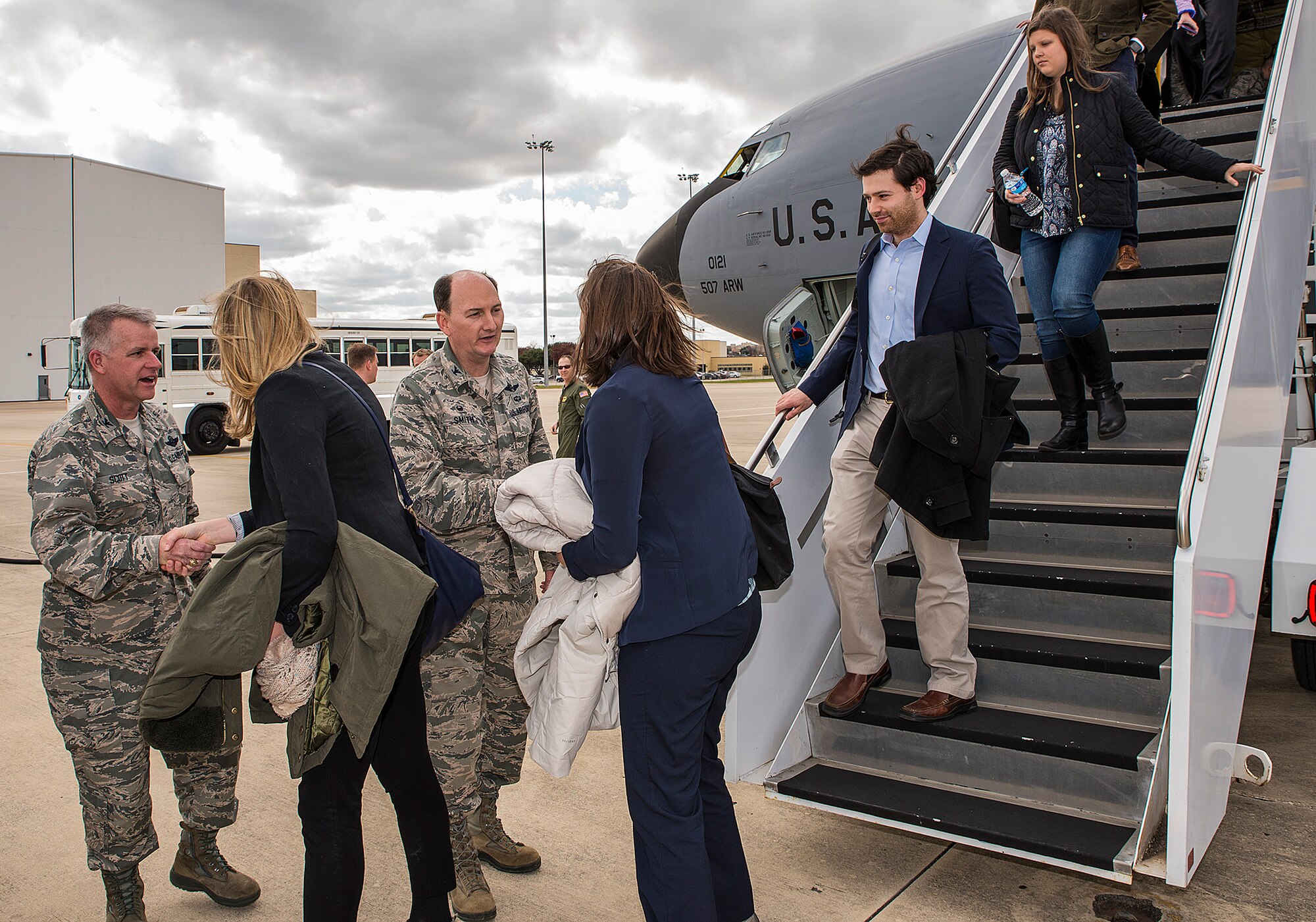 Col. David A. Scott, (left) 433rd Airlift Wing commander and incoming wing commander Col. Thomas K. Smith, greet a Congressional Air Force Reserve lead staff delegation from Washington D.C. as they disembark from a KC-135 Stratotanker Jan. 19, 2016 at Joint Base San Antonio-Lackland, Texas. During their visit to JBSA, staffers received a 433rd AW mission brief, toured the 733rd Training Squadron and experience a flight in a C-5 flight simulator. (U.S. Air Force photo by Benjamin Faske) (Released) 