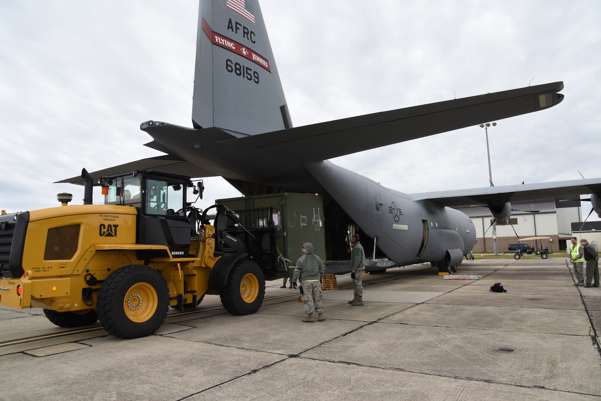 Members of the 403rd Wing load cargo onto an aircraft during Exercise Agile Sabre at Keesler Air Force Base, Mississippi, Jan. 14, 2016. (U.S. Air Force photo/Staff Sgt. Nicholas Monteleone)