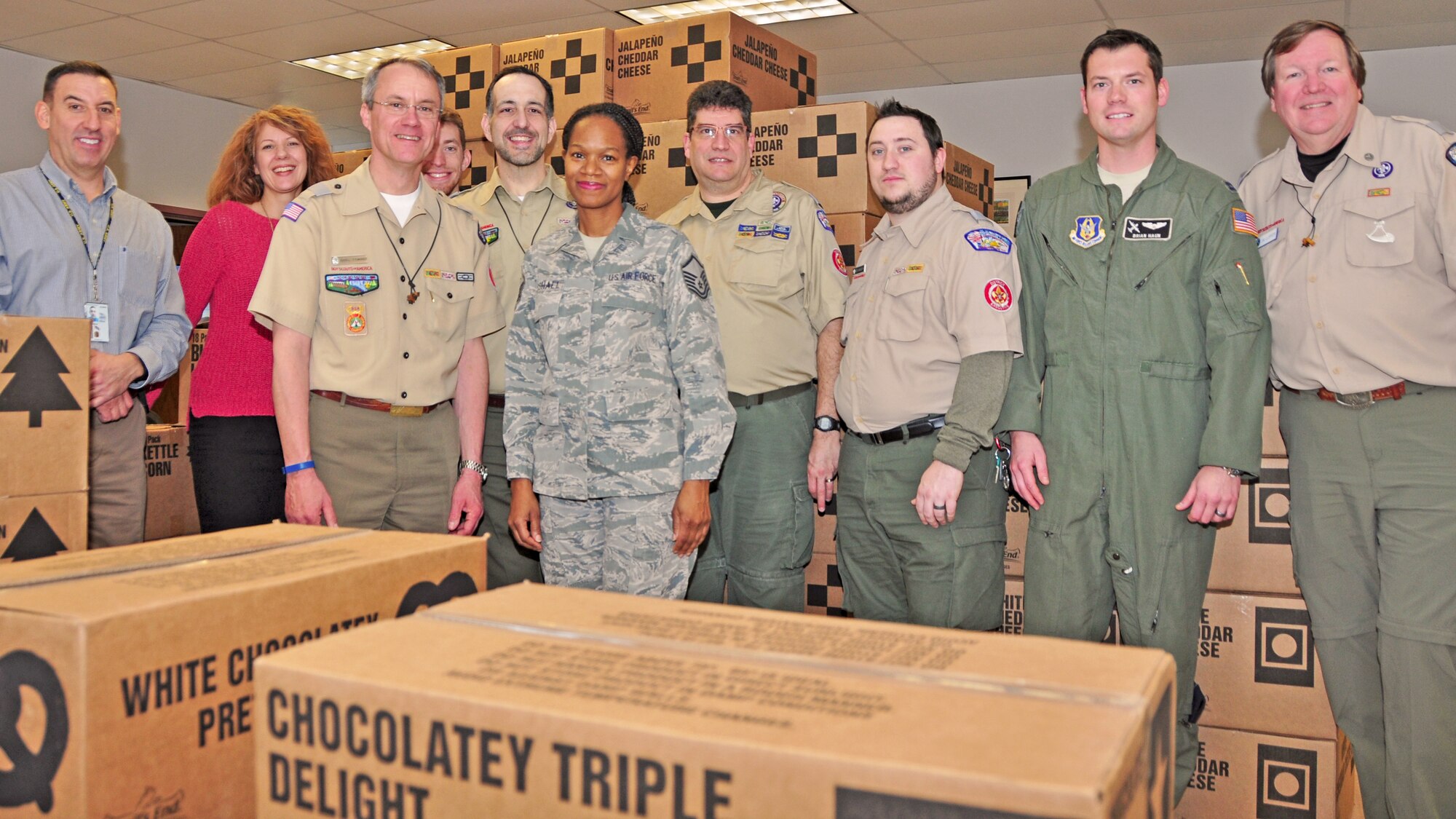 Members of the Boy Scouts of America from the Greater Niagara Frontier Council pose with members of the 914th Niagara Falls Airlift Wing at the Airman and Family Readiness Center on January 6, 2016. The groups worked together to unload a donation of more than 130 cases of Boy Scout popcorn. (U.S. Air Force photo by Staff Sgt. Richard Mekkri)