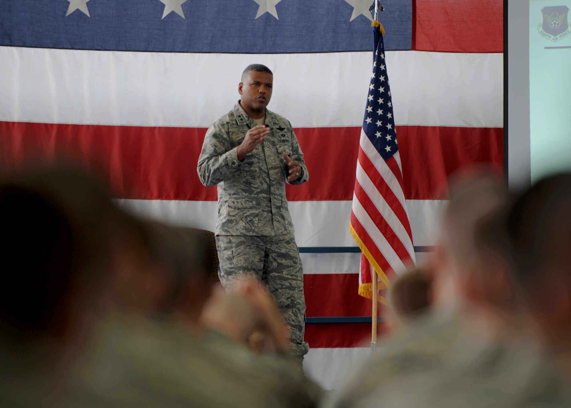 Maj. Gen. Richard Clark, Eighth Air Force commander, addresses bomber Airmen during an all-call at Ellsworth Air Force Base, S.D., Jan. 20, 2016. To close the all-call, Clark showed a motivational video, reminding Airmen to stay committed to the Air Force core value of excellence in all we do and to their mission. (U.S. Air Force photo by Airman 1st Class Denise M. Nevins/Released)