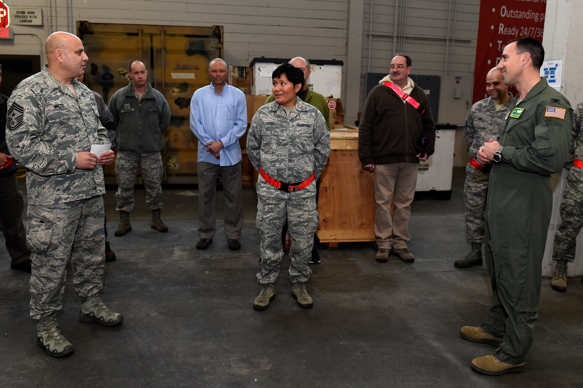 Staff Sgt. Lea Keedo, (center) 62nd Aerial Port Squadron, is notified of her selection to technical sergeant through the Stripes for Exceptional Performers Program by Chief Master Sgt. Zaki Mazid, 62nd Airlift Wing command chief (left) and Col. Leonard Kosinski, 62nd AW commander, at Joint Base Lewis-McChord, Wash., Jan. 19, 2016. The Stripes for Exceptional Performers Program enables commanders and senior officers to select a limited number of enlisted Airmen, with exceptional potential for promotion, to the grades of staff sergeant and technical sergeant. (U.S. Air Force photo by Tech. Sgt. Tim Chacon)