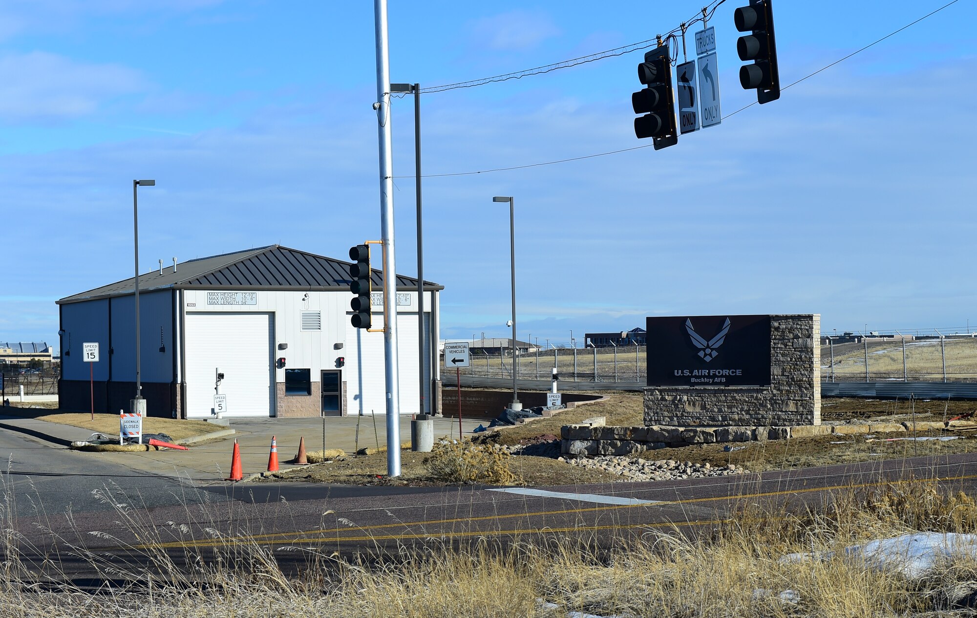 New signs stand at the Mississippi Gate Jan. 21, 2016, on Buckley Air Force Base, Colo. The new signs are one of many ongoing construction initiatives designed to improve the installation. (U.S. Air Force photo by Airman 1st Class Gabrielle Spradling)