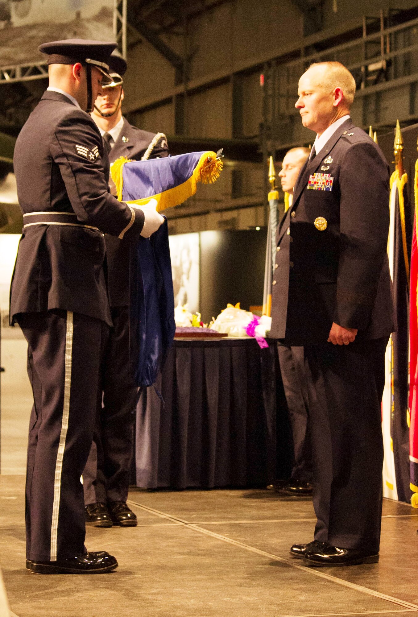 The Wright Patterson Air Force Base Honor Guard unfurls the general officer
flag for Brig. Gen. Michael Schmidt during the pinning-on ceremony.
