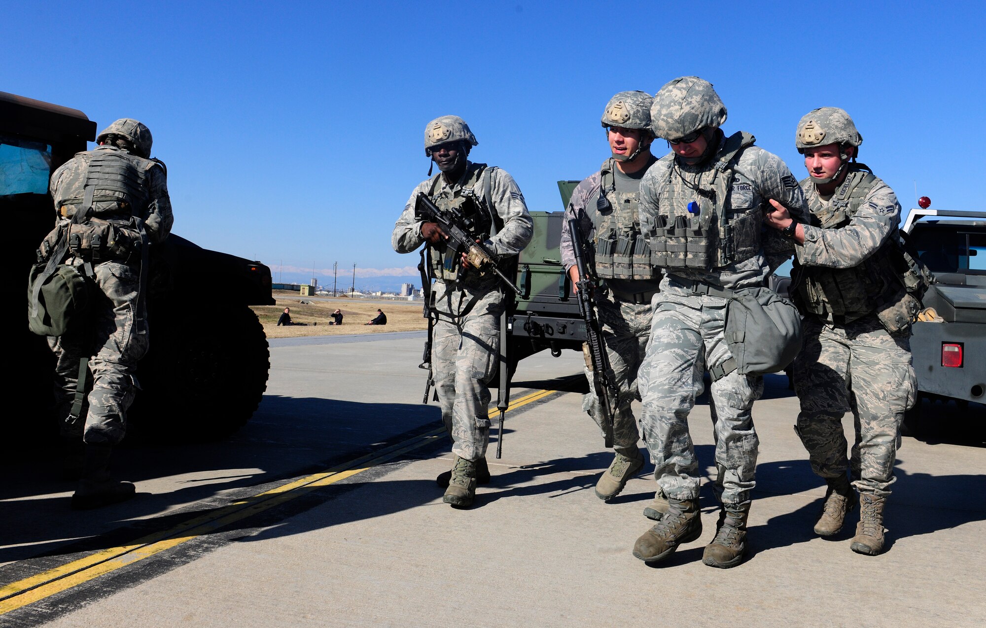 Airmen from the 39th Security Forces Squadron apprehend a simulated suspect during a wing exercise Jan. 15, 2016, at Incirlik Air Base, Turkey. The defenders responded to simulated opposing forces, arrested suspects and practiced body searching techniques. (U.S. Air Force photo by Senior Airman Krystal Ardrey/Released)