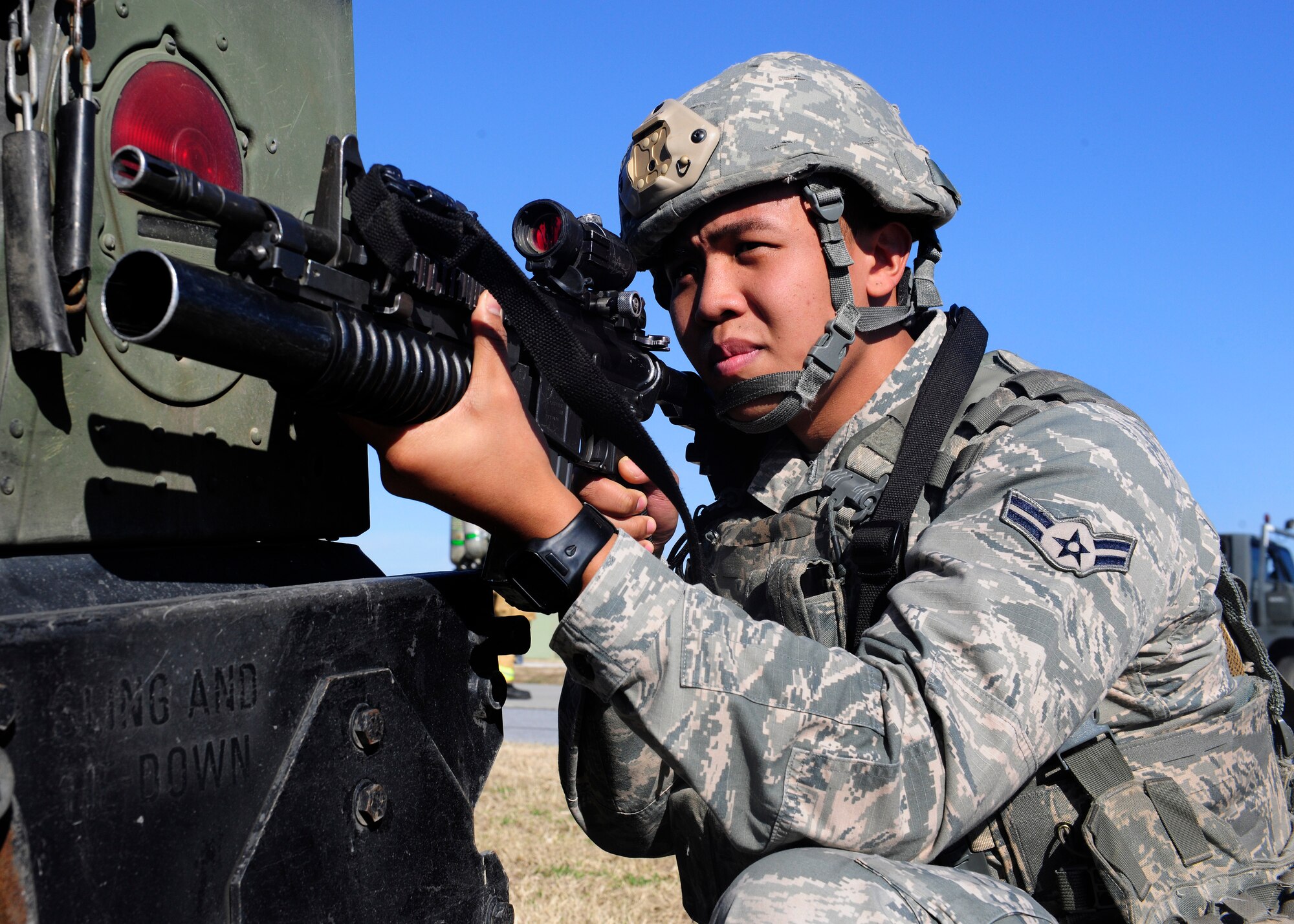 Airman 1st Class Jordanrey Queral, 39th Security Forces Squadron security response team member, provides security during a wing exercise Jan. 15, 2016, at Incirlik Air Base, Turkey. Queral ensured the area was secure while fellow defenders practiced body searching techniques on simulated opposing forces. (U.S. Air Force photo by Senior Airman Krystal Ardrey/Released)